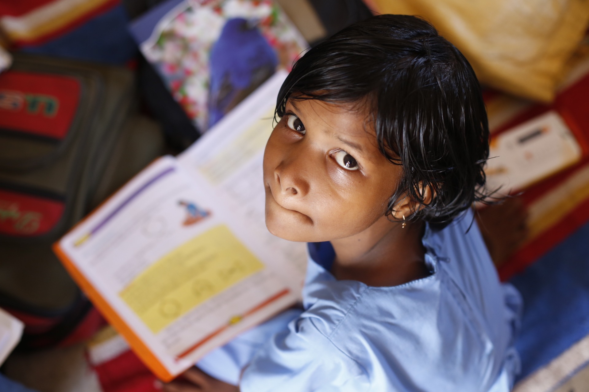 Little girl reading a book